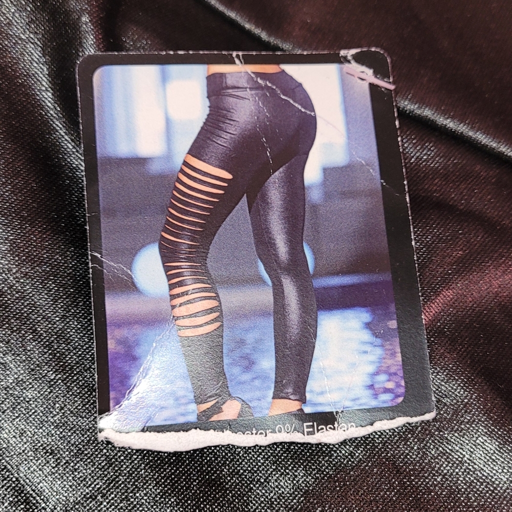 Sexy black pants with cuts throughout legs